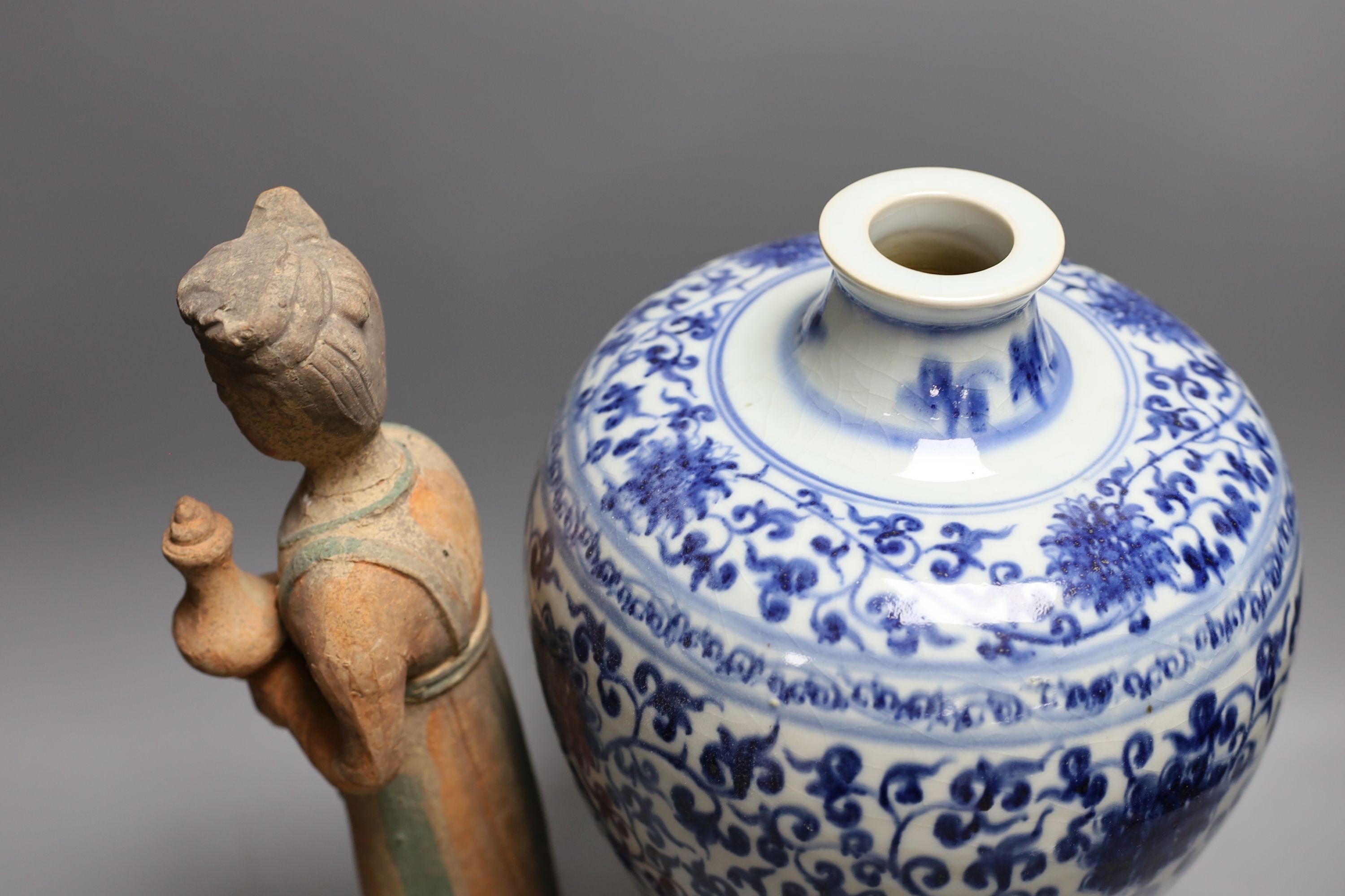 A large Chinese blue and white meiping and a Tang style pottery figure (2), vase37 cms high.